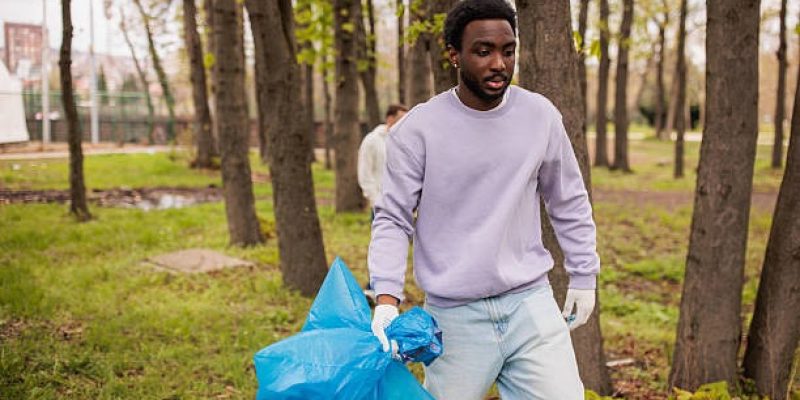 imgi_58_young-man-finalizing-a-cleaning-operation-in-a-forest